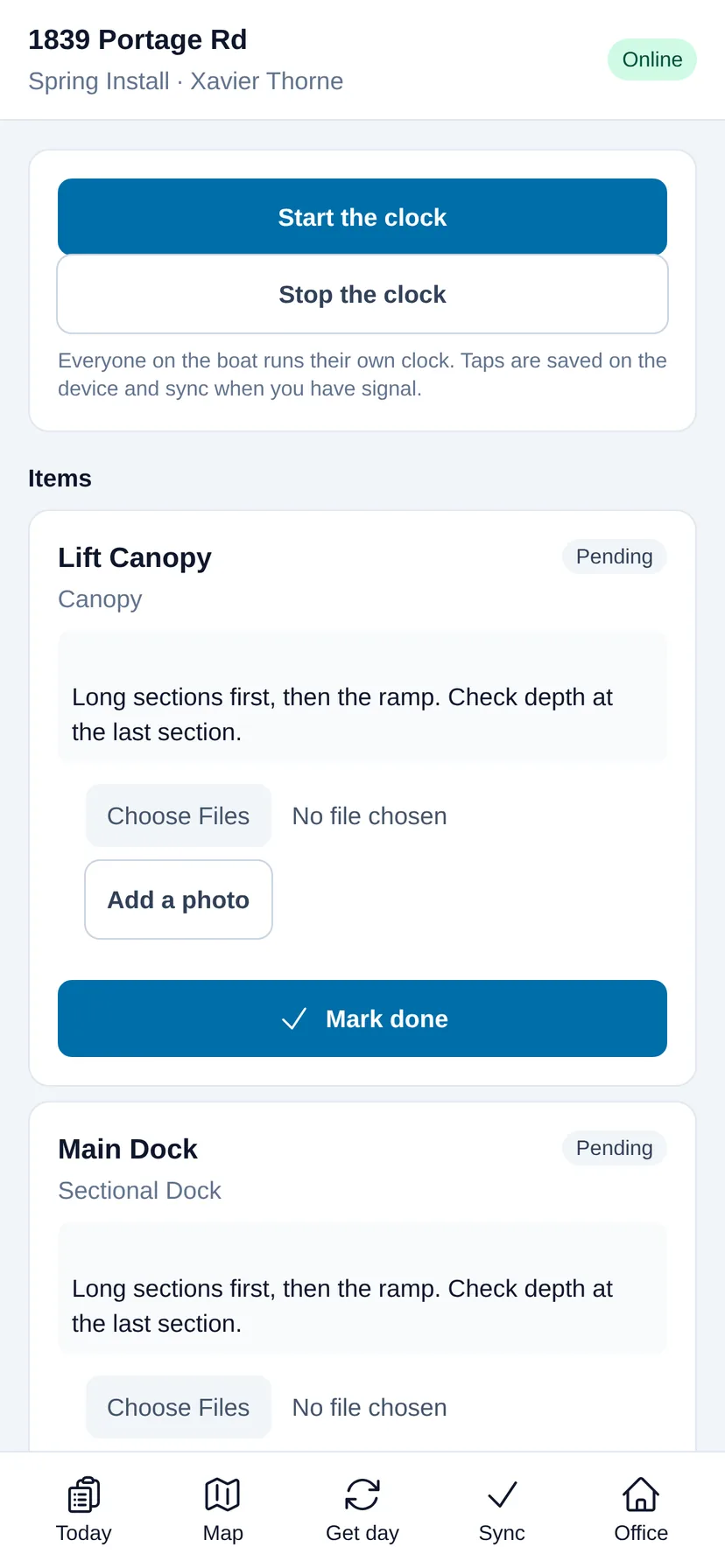 The LakeOps crew app on a phone: the property address, start and stop clock buttons, an access note reading “Weedy through July — the skiff gets in, the big barge grounds out”, and each piece of equipment with its install note, a photo button and a Mark done button