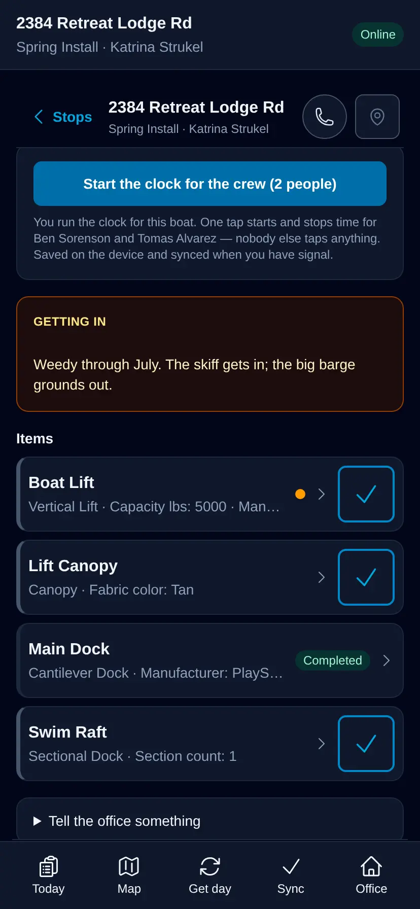 The LakeOps crew app on a phone: the property address, start and stop clock buttons, an access note reading “Weedy through July — the skiff gets in, the big barge grounds out”, and each piece of equipment with its install note, a photo button and a Mark done button