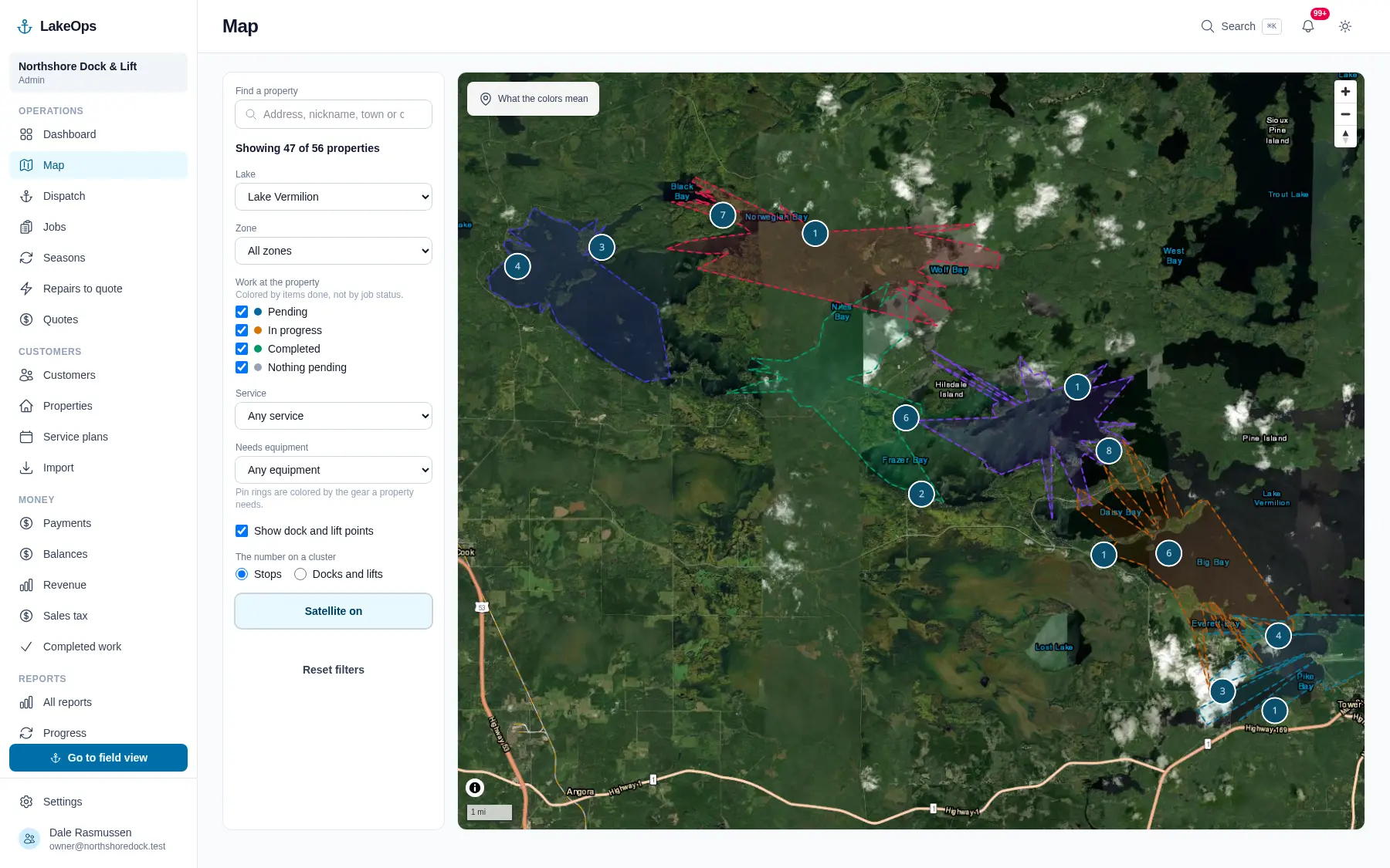 The LakeOps map over satellite imagery: properties pinned along a shoreline, zones outlined the way you split your lakes, and a filter panel for lake, zone, service and required equipment