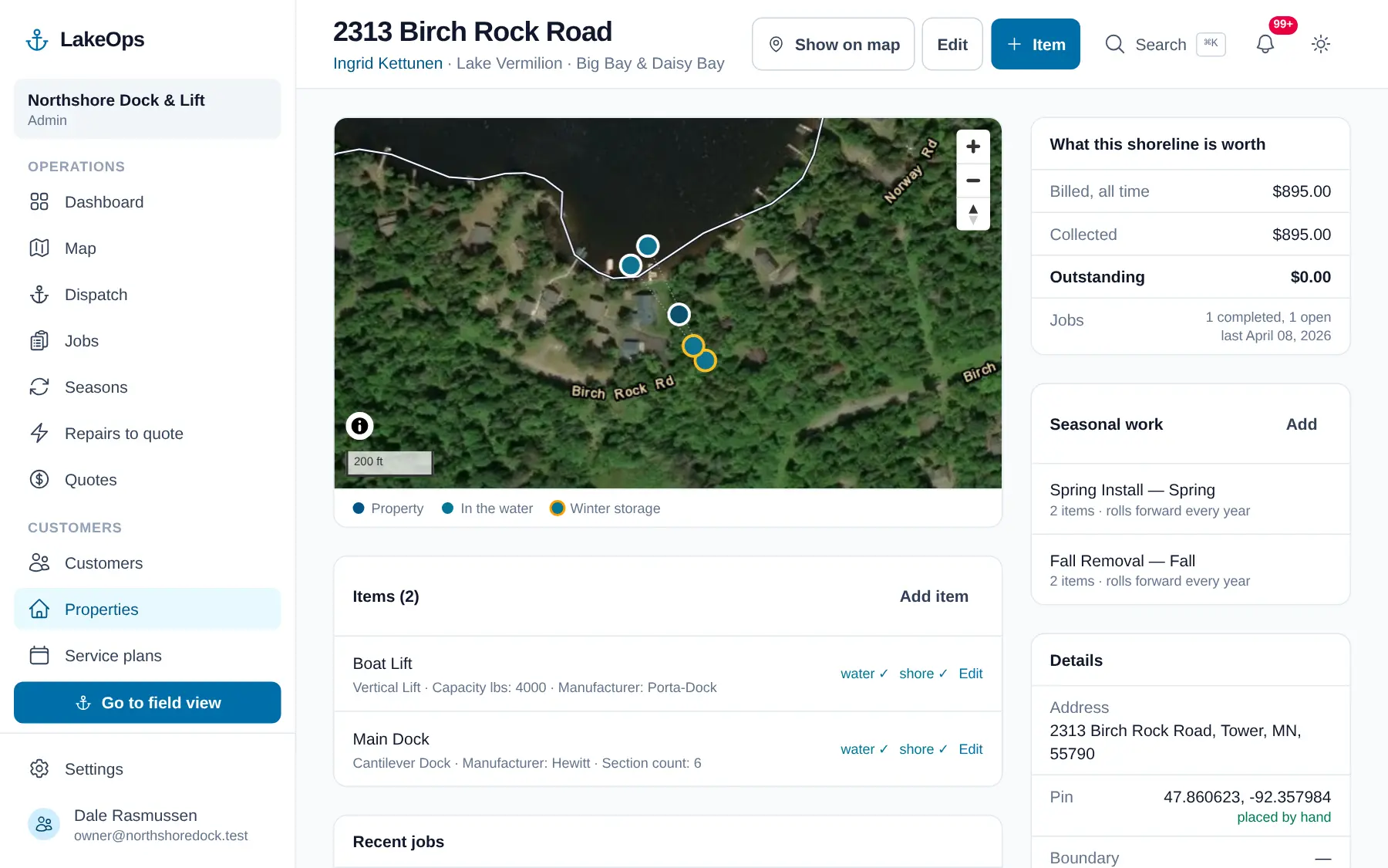 A LakeOps property record: each dock section, lift and canopy listed with its specs, its install and winter-storage pins, and reference photos of both states